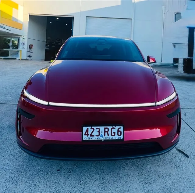 Deep red EV with a high-gloss ceramic coating finish